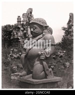 Historical photograph of Candi Sewu temple complex. One of the two colossal rakshasas at the east entrance. Less than 1km north of Prambanan, near Yogyakarta, Java, Indonesia.  8th century CE.  Candi Sewu is the second largest Buddhist temple complex in Indonesia; Borobudur is the largest. Stock Photo