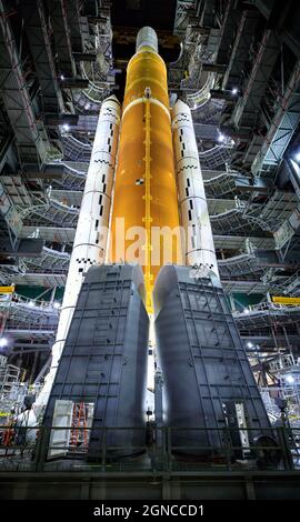 Inside High Bay 3 of the Vehicle Assembly Building at NASAÕs Kennedy Space Center, Florida. The work platforms have been retracted from around the Artemis I Space Launch System atop the mobile launcher. In later missions, NASA will land the first woman and the first person of color on the Moon. Sept. 20, 2021.  An optimised and digitally enhanced version of a NASA image / credit NASA. Stock Photo