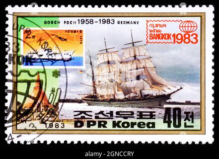 NORTH KOREA - CIRCA 1977: A stamp printed in DPRK shows image of Gorch Fock II, a tall ship of the German Navy 1958 and flag of Germany, series Stock Photo