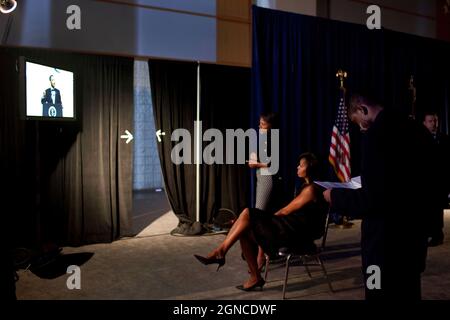 First Lady Michelle Obama watches backstage as President Obama delivers a speech at the Congressional Black Caucus Foundation's Annual Phoenix Awards Dinner, at the Walter E. Washington Convention Center, Washington, D.C. Sept. 25, 2009.   (Official White House Photo by Samantha Appleton) This official White House photograph is being made available only for publication by news organizations and/or for personal use printing by the subject(s) of the photograph. The photograph may not be manipulated in any way and may not be used in commercial or political materials, advertisements, emails, produ Stock Photo