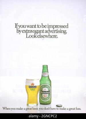 Vintage advertisement of Heineken beer 1980s 1970s Heineken bottle with Heineken glass paper adver magazine advert Stock Photo