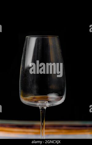 Transparent dirty wine glass on color wooden table Stock Photo