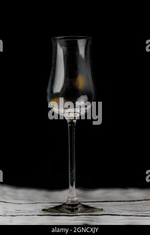 Transparent dirty wine glass on color wooden table Stock Photo