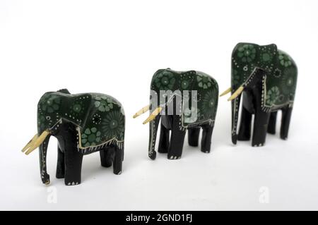 Elephant family, wooden elephants, three elephants, hand-painted wooden elephants, handicraft, African elephants, souvenir Africa, painted elephants, Stock Photo