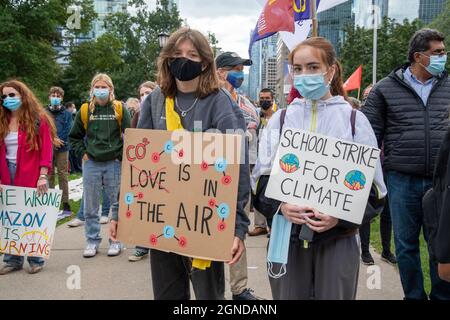 Young people with environmentalist signs during the Global Climate March organized by Fridays For Future in front of the Provincial Legislative Buildi Stock Photo