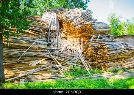 huge pile of large sawn logs bars from the forest Stock Photo