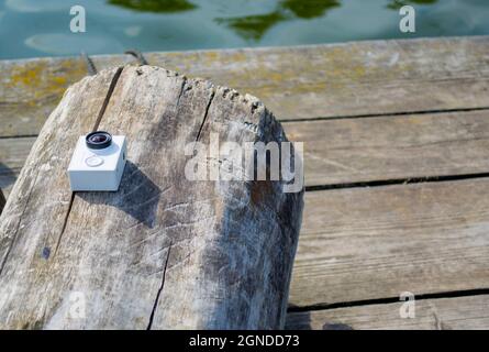 Action camera on a log Stock Photo