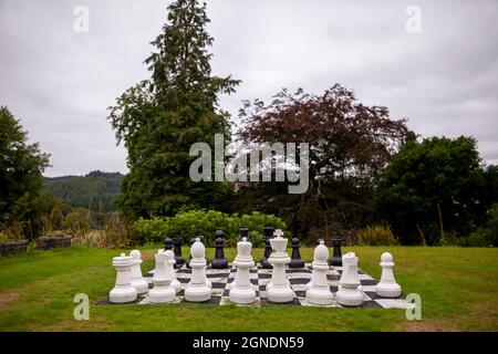 Giant Chess set in an English countryside garden. Stock Photo