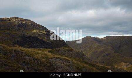 Walking up the Old Man Of Coniston in the Lake district in Cumbria. Stock Photo