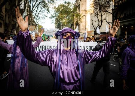 Buenos Aires, Argentina. 24th Sep, 2021. Demonstrators wearing purple costumes perform during the demonstration. This Friday, different organizations gathered in the Plaza del Mayo to join the national and global demonstrations calling for urgent measures to be taken to reverse the climate crisis. Credit: SOPA Images Limited/Alamy Live News Stock Photo