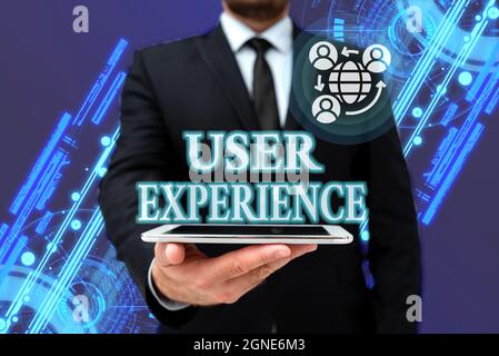 Text sign showing User Experience. Business approach the overall experience of a person using a product Man In Office Uniform Holding Tablet Stock Photo