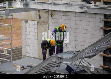 Bucharest, Romania - September 23, 2021: Construction workers on a construction site in Bucharest. Stock Photo