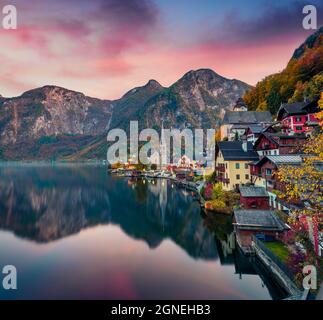 Dramatic autumn sunset on Hallstatt lake. Impressive evening viev of Hallstatt village, in Austria's mountainous Salzkammergut region, Austria. Beauty Stock Photo