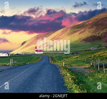 Dramatic summer sunset with Reyniskirkja church, Vik village location. Colorful outdoor scene in the south coast of Iceland, Europe. Traveling concept Stock Photo