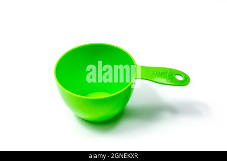 Green ingredient measuring scoop or spoon - full size. Isolated on white background with Clipping path Stock Photo