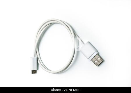 White Cable to connect micro USB devices to the USB port on your computer or laptop. Stock Photo