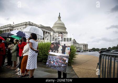 Washington DC, USA. 25th Sep, 2021. Kaif Johnson holds a poster board photo showing Haitian refugees on the US / Mexico border in Texas, during a press conference on the treatment of Haitian immigrants at the US border, outside the US Capitol in Washington, DC, USA, on Wednesday, September 22, 2021. Photo by Rod Lamkey / CNP/ABACAPRESS.COM Credit: Abaca Press/Alamy Live News Stock Photo