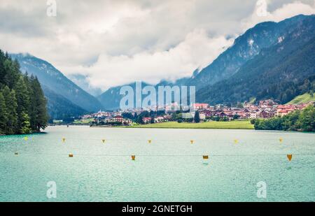 Great summer view of Auronzo di Cadore and its lake in province of Belluno, Veneto, Italy. Dramatic morning scene of Dolomite Alps. Traveling concept Stock Photo