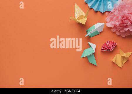 high angle view origami paper art craft orange surface. High quality and resolution beautiful photo concept Stock Photo