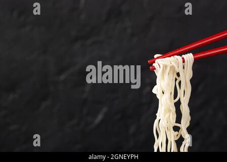 front view noodles chopsticks with copy space. High quality and resolution beautiful photo concept Stock Photo