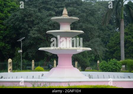 Beautiful rounded fountain in the park . fountain made with concrete. Stock Photo