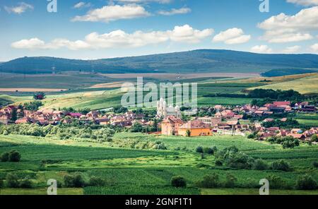 Picturesque summer landscape of typical romanian village - Petrestii de Jos. Colorful morning scene of Cluj country, Romania, Europe. Beauty of countr Stock Photo