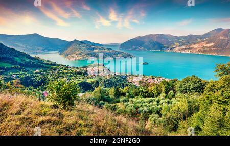 Aerial summer view of Iseo lake. Bright morning cityscape of Marone town with Monte Isola island, Province of Brescia, Italy, Europe. Traveling concep Stock Photo