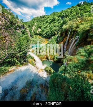 Amazing morning view of Plitvice National Park. Bright spring scene of green forest with pure water lake and waterfall. Great countryside view of Croa
