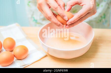 Baking process for cupcakes, egg beating, female chef and baker Stock Photo