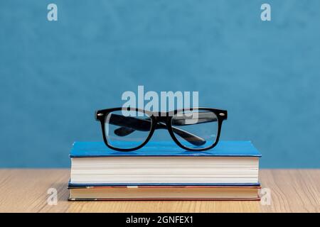 front view books with glasses. High quality and resolution beautiful photo concept Stock Photo