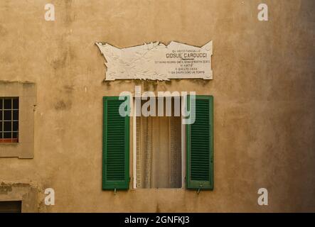 Memorial plaque on the home of the famous Italian poet Giosuè Carducci, who gave his name to the village of Castagneto Carducci, Livorno, Tuscany Stock Photo