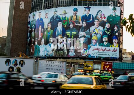 IRAN. TEHRAN. IMMENSE FRESCOES WHICH CELEBRATE THE SOCIAL, PROFESSIONAL AND FAMILY MODEL SET UP BY THE ISLAMIC POWER Stock Photo