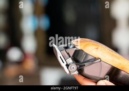 Hairdressing machine with some scratches from use. Personalized hair clipper  Stock Photo