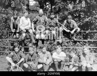 Members of the 28th Company, Beckenham Boy Scouts taking a break during a hiking trip. 1920s/1930s. Stock Photo