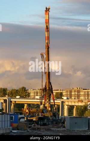 Machine for boring earth at construction site. Vertical tamrock pile foundation drilling machine.  Stock Photo