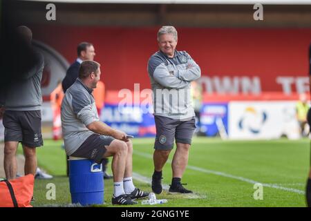 Crawley Sussex UK 25th September 2021 - Crawley manager John Yems looks cheerful  during the Sky Bet League Two match between Crawley Town and Bradford City at the People's Pension Stadium  : Credit Simon Dack /TPI/ Alamy Live News - Editorial use only. No merchandising. For Football images FA and Premier League restrictions apply inc. no internet/mobile usage without FAPL license - for details contact Football Dataco Stock Photo