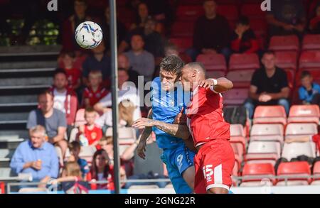 Crawley Sussex UK 25th September 2021 - Andy Cook of Bradford and Ludwig Francillette of Crawley battle for the ball during the Sky Bet League Two match between Crawley Town and Bradford City at the People's Pension Stadium  : Credit Simon Dack /TPI/ Alamy Live News - Editorial use only. No merchandising. For Football images FA and Premier League restrictions apply inc. no internet/mobile usage without FAPL license - for details contact Football Dataco Stock Photo