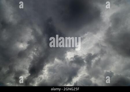 grey incoming storm clouds full frame background Stock Photo