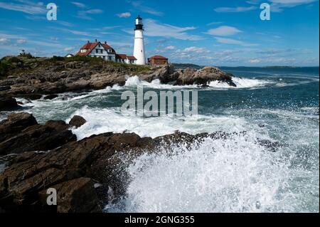 Waves surround Portland Head Lighthouse during high tide in Maine. Image taken on 9-11, twenty years later symbolizing freedom and security. Stock Photo