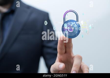 3D symbol of cybersecurity with a man in the background Stock Photo