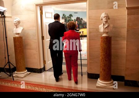 President Barack Obama escorts former First Lady Nancy Reagan into the Diplomatic Room of the White House June 2, 2009, for the announcement and signing of the Ronald Reagan Centennial Commission Act--commemorating the late President's 100th Birthday in 2011. (Official White House Photo by Pete Souza) This official White House photograph is being made available for publication by news organizations and/or for personal use printing by the subject(s) of the photograph. The photograph may not be manipulated in any way or used in materials, advertisements, products, or promotions that in any way s Stock Photo