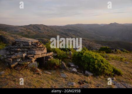 Cortelho, a small, rudimentar, stone-built shelter used by sheperds when herding cows in the highlands of the Soajo mountains. Stock Photo