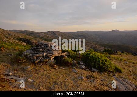 Cortelho, a small, rudimentar, stone-built shelter used by sheperds when herding cows in the highlands of the Soajo mountains. Stock Photo