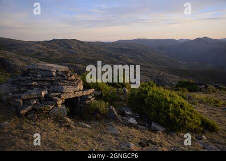 Cortelho, a small, rudimentar, stone-built shelter used by sheperds when herding cows in the highlands of the Soajo mountains. Stock Photo