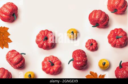 Creative pattern, autumn background. Orange pumpkins on a white background. Halloween. Stock Photo