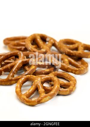 Salted mini pretzel snacks isolated on white background Stock Photo