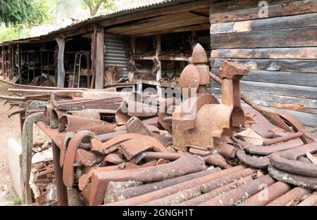 Don Quixote. Organized junkyard. Old worn out rusty machine parts and tools used in industry, transportation. Grouped and stored by type and material. Stock Photo