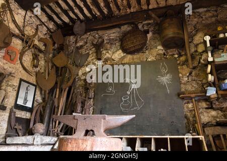Anvil. A metalworker’s workshop equipped with tools used in the old days and still used today. Suitable for making artistic ironwork. Stock Photo