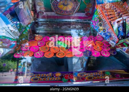 Coin pusher machine with a lot of coins Stock Photo