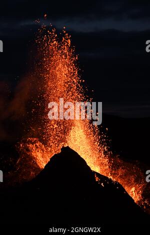 Eruption at Fagradalsfjall, Iceland. Incandescent lava is erupted from the volcanic vent. Taken at night, the lava is isolated on a black background. Stock Photo
